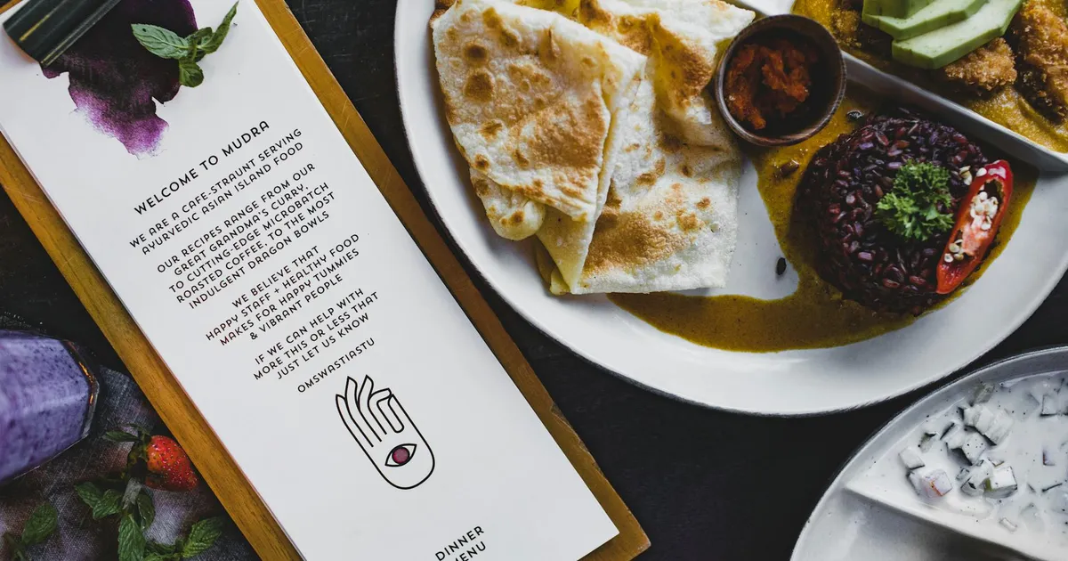 Restaurant chef carefully preparing a food allergy-safe meal with separate utensils