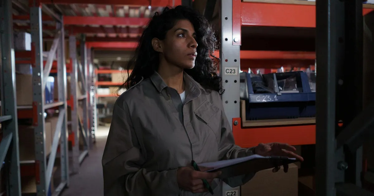 Restaurant manager checking inventory and supplier documentation for food recall compliance