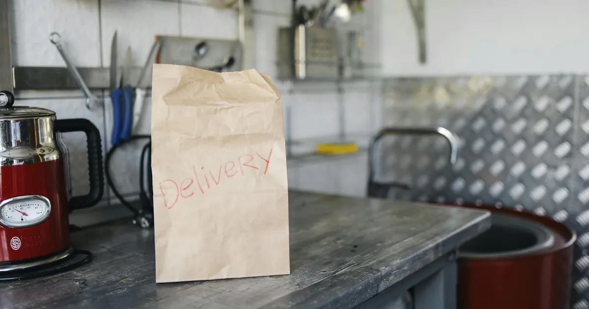 Modern ghost kitchen facility with organized stations optimized for delivery operations