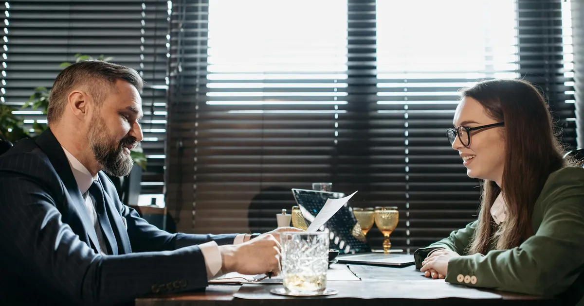 Restaurant manager in professional discussion with health department official