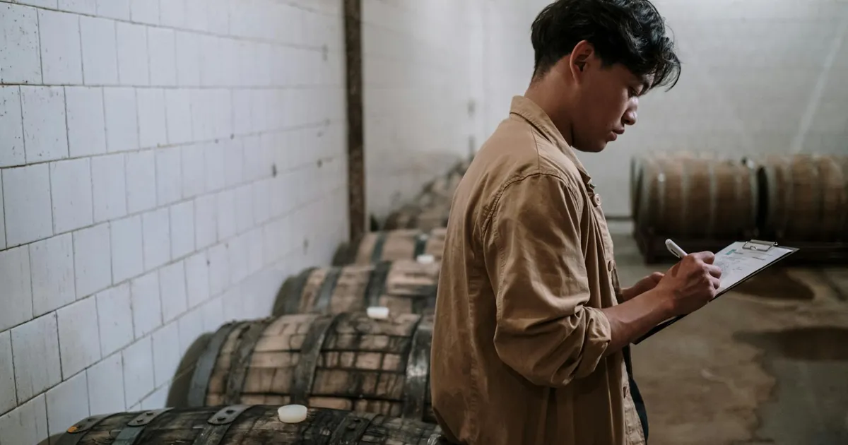Restaurant manager reviewing compliance checklist on clipboard