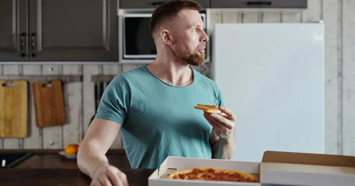 Chef reheating food in a commercial kitchen