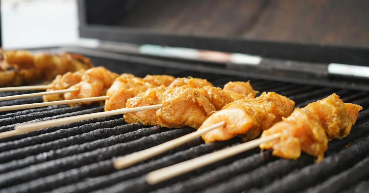Chicken being cooked in a commercial kitchen